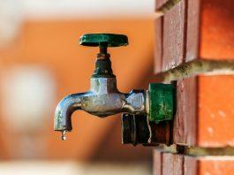 Water supply, outdoor garden faucet with green handle